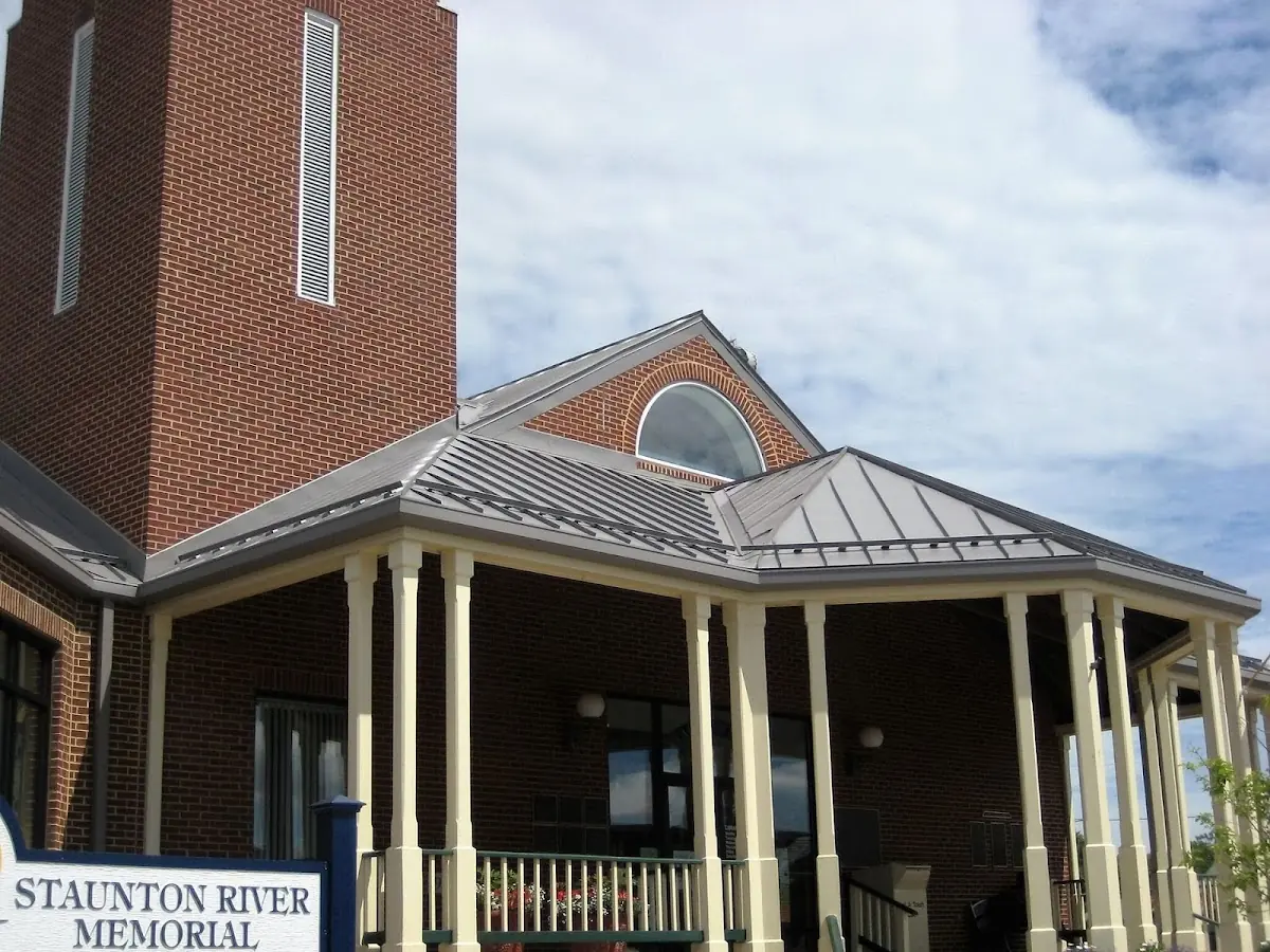 Skilled roofing craftsmen working on a residential roof in Minden